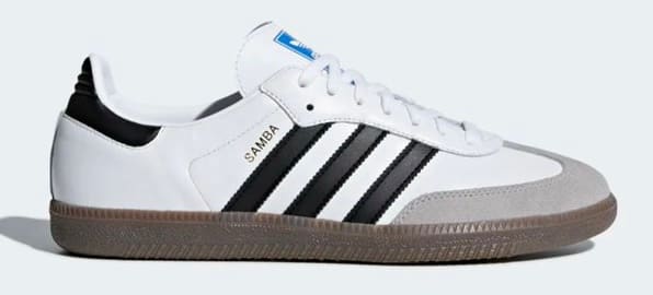 Side view of a white and black adidas shoe.